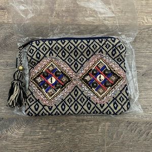 12th Tribe tassel beaded clutch. Brand new never used.